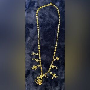 Vintage gold Cupid necklace, 30 inches long.